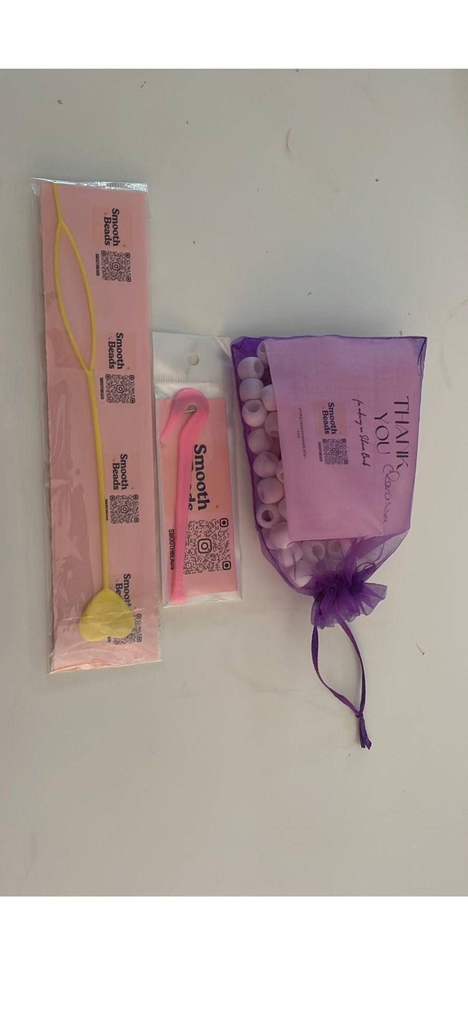 Our beautiful eco friendly organza gift bags, your bead loader and your rubber band cutter all included